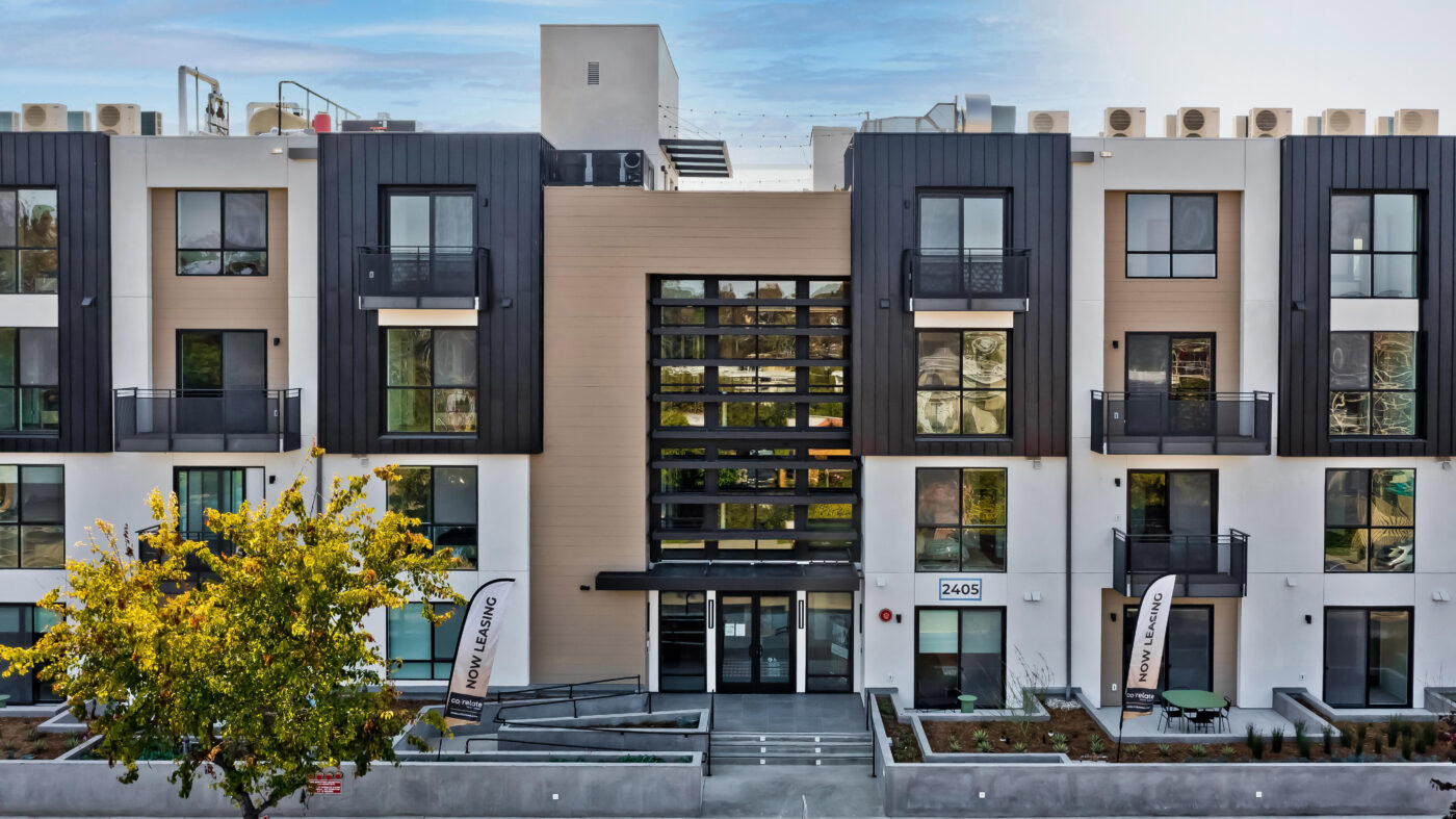 Building entrance with landscaped sidewalk