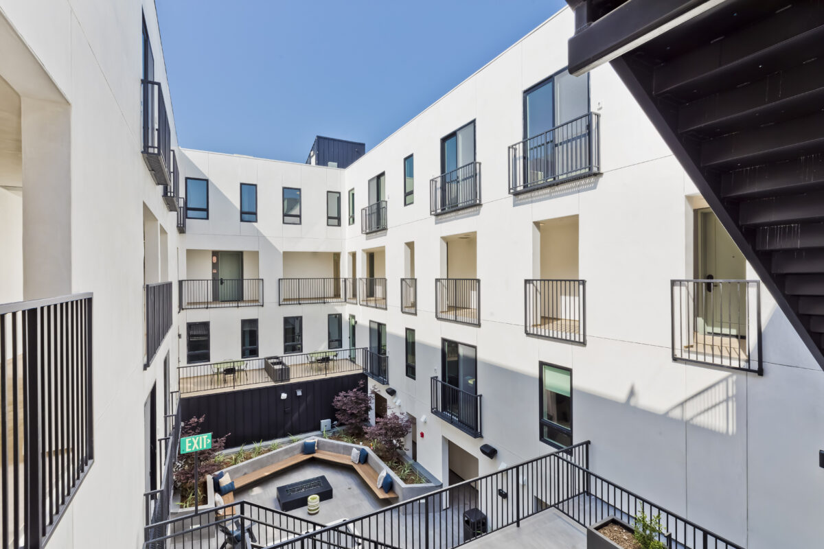 outdoor common area with seating and game tables