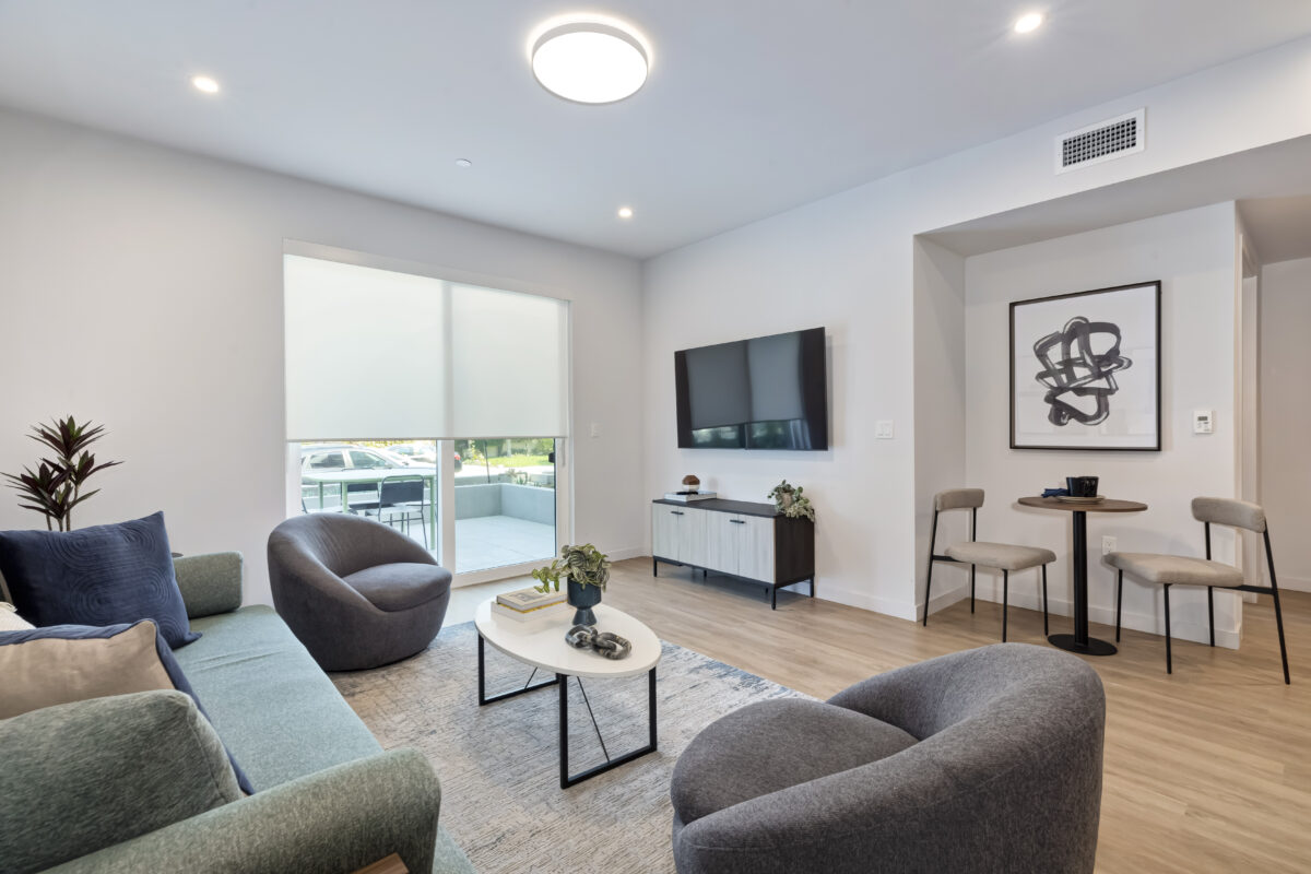 living room with sofa set and TV