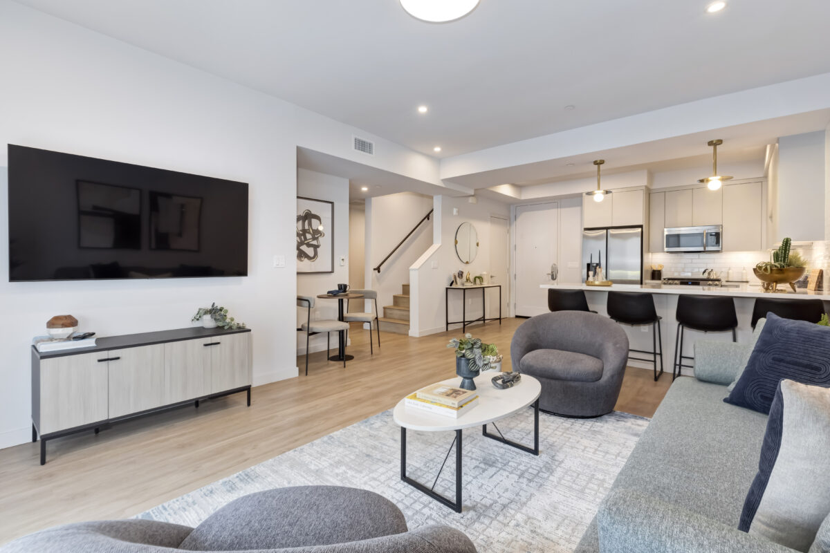 living room with modern decor and view of kitchen