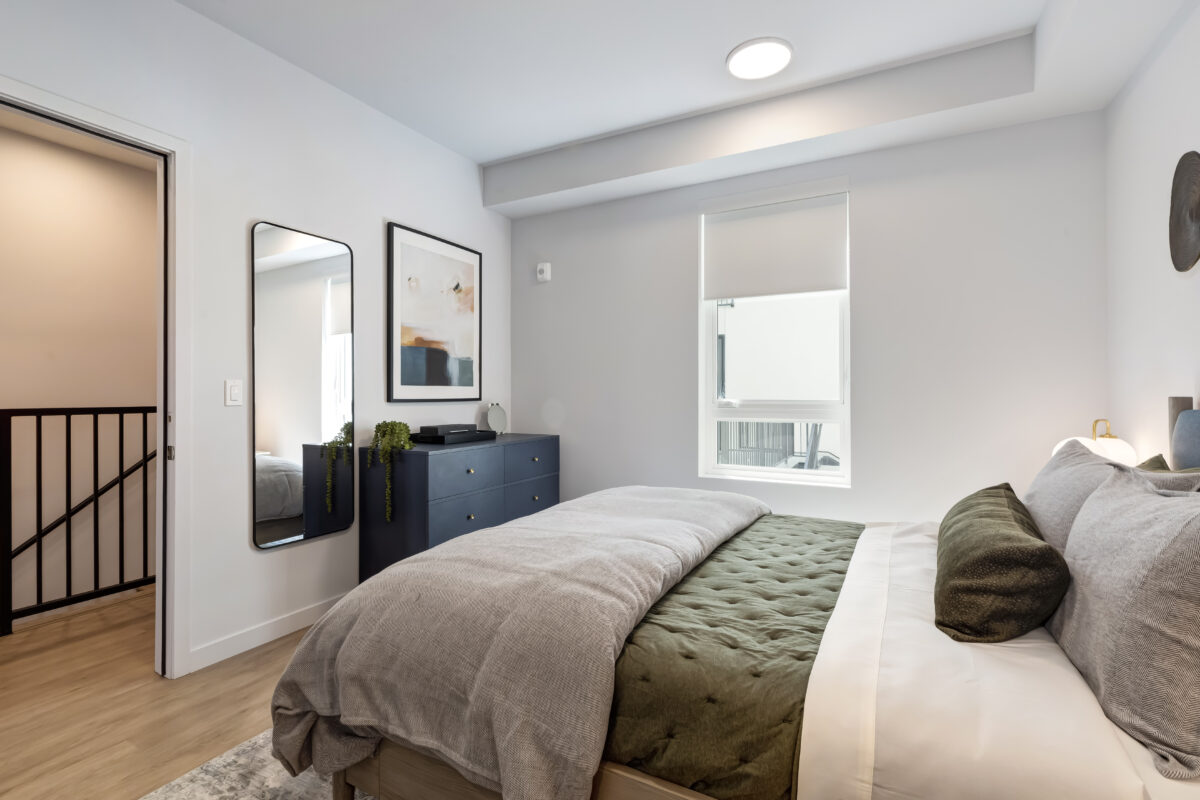bedroom with modern decor and large window