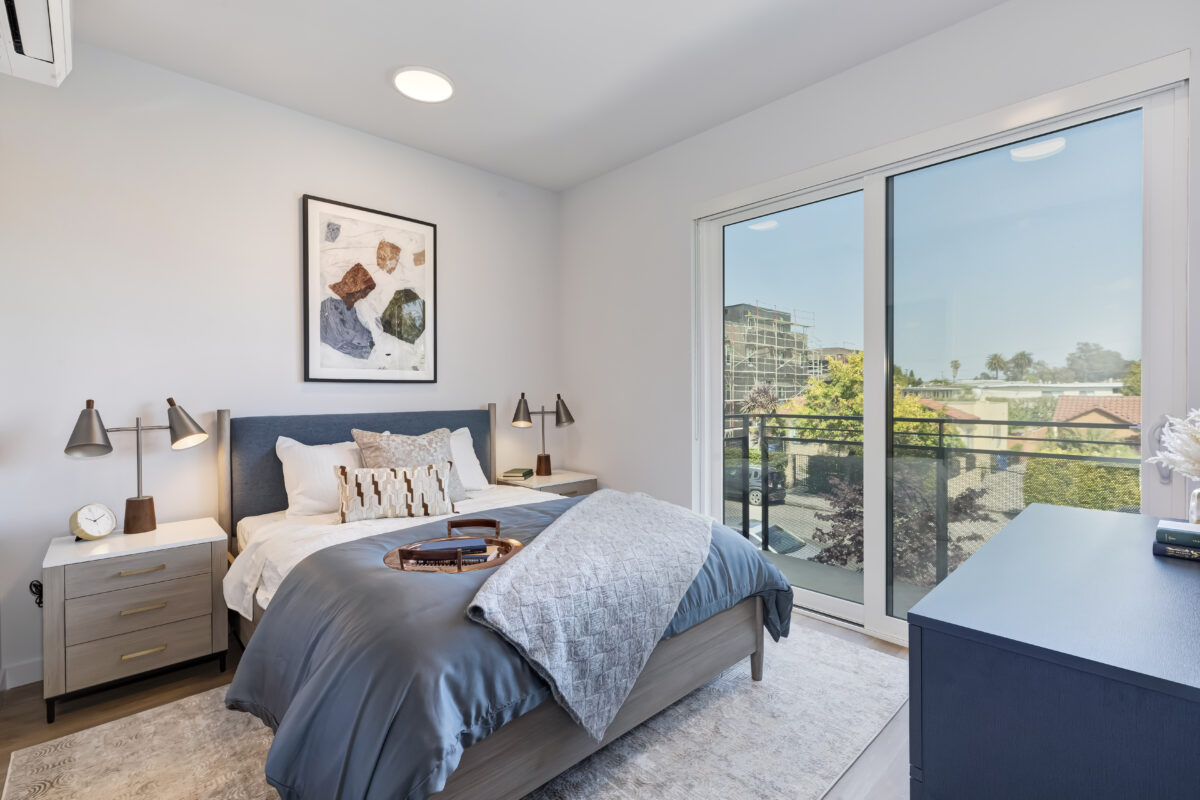 bedroom with modern decor and large doors