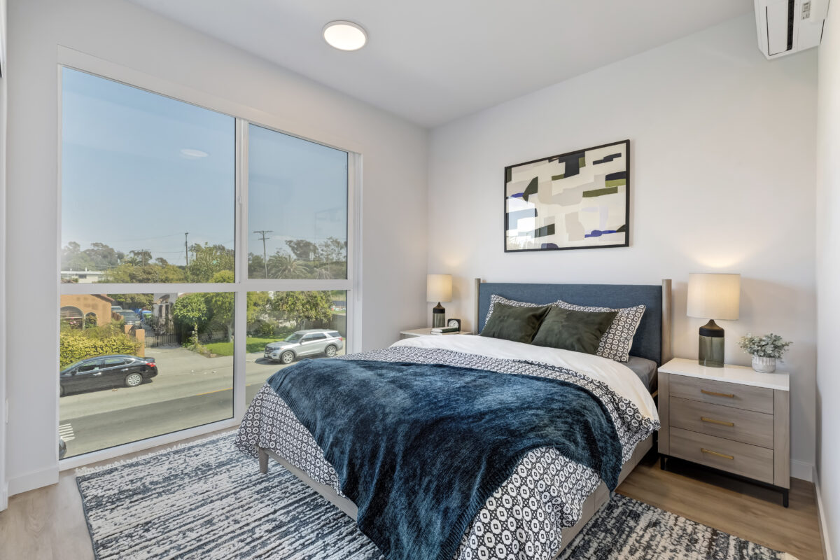 bedroom with modern decor and large window