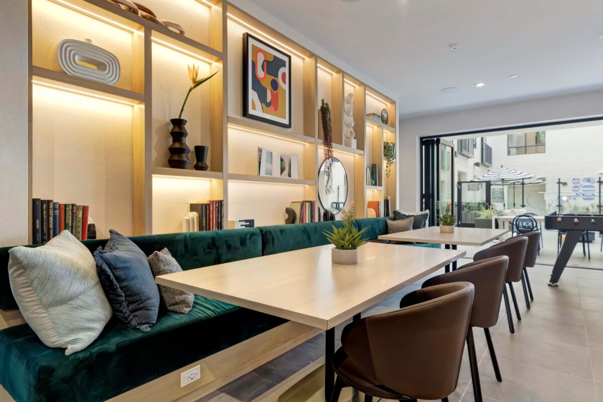 Clubhouse lounge with booth seating and foosball table
