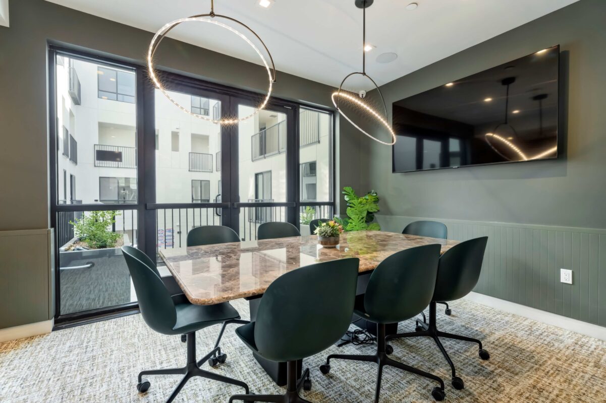 Conference room with meeting table and TV